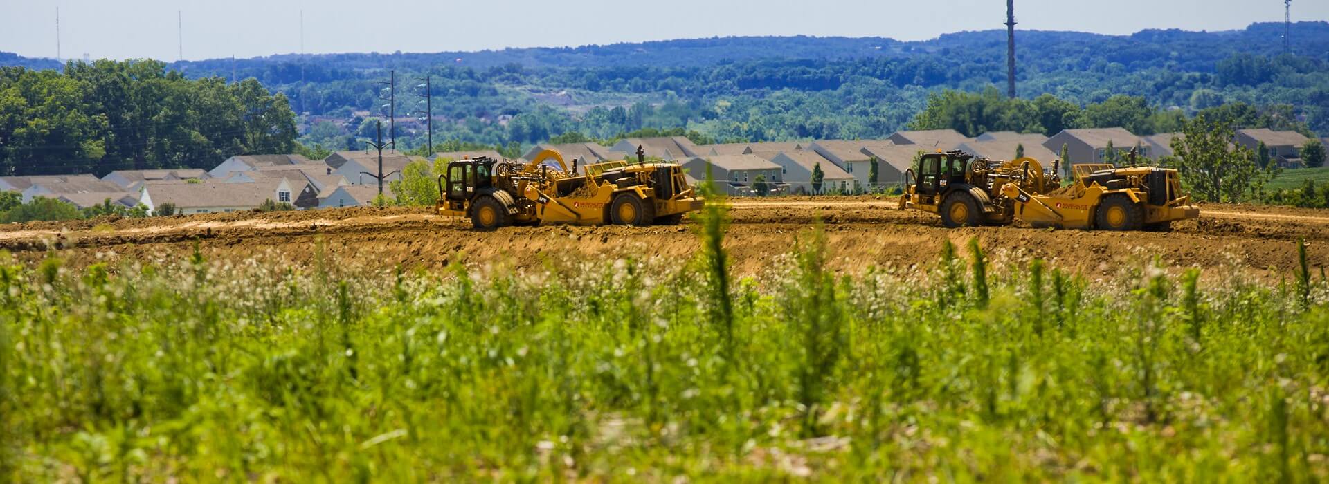 Construction equipment developing land